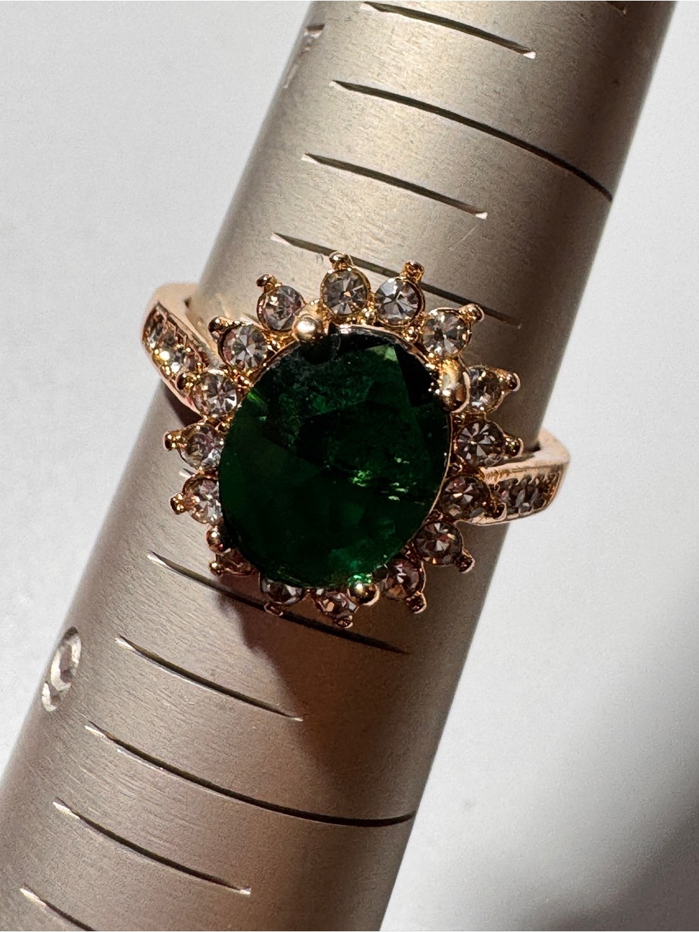 Emerald Green Oval Halo Ring in Gold Tone